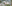 Close up of a white and pink flower with a blurry back ground.